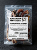 Honey On Duty Provisions 8oz Premium Beef Chews packaging - single ingredient slow dehydrated dog treats in clear bag on teal background, made and sourced in USA